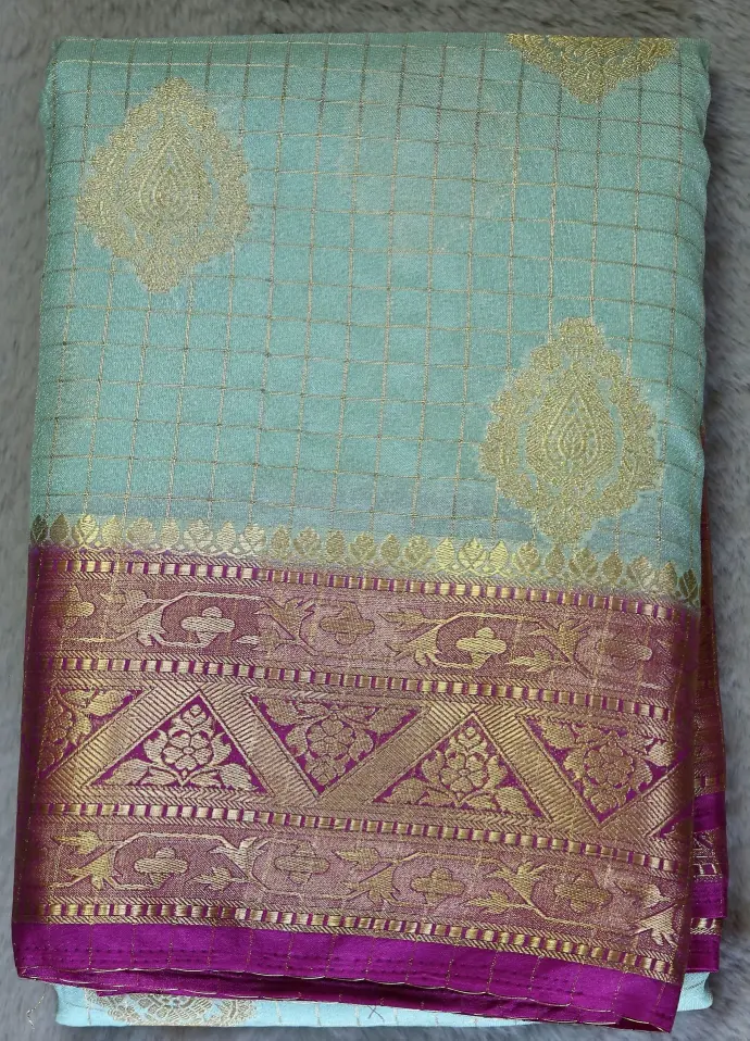 Mint green and magenta color georgette Saree with glod Zari work 