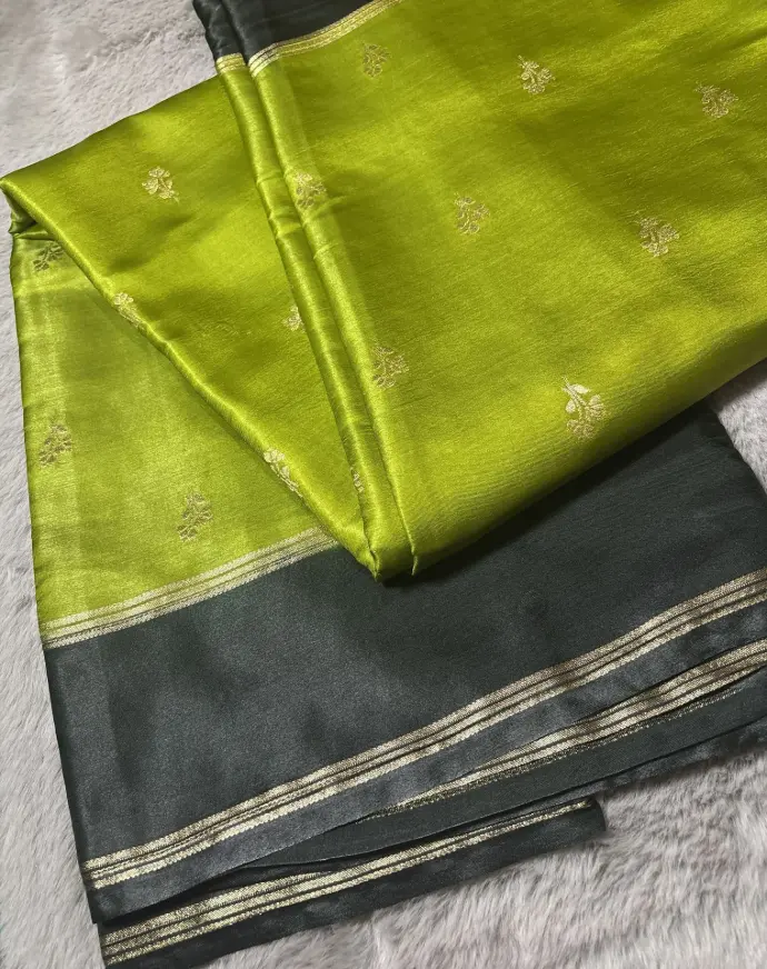 Vibrant and elegant combination of parrot green and charcoal grey Gaji silk saree