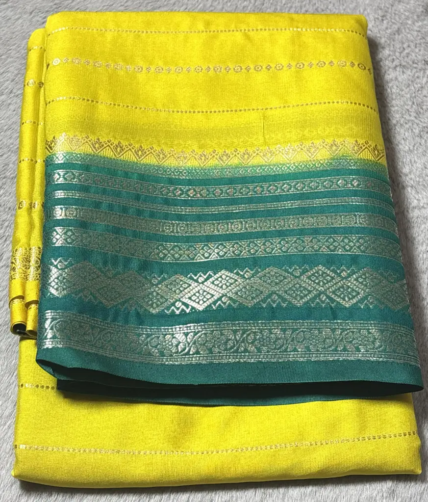Mustard yellow Crepe Silk Saree with Bottle green Zari Border