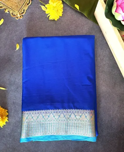 [E-COM019] Royal blue Crepe silk saree featuring a sky blue and gold zari woven border