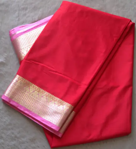 [E-COM020] Red Crepe silk saree featuring a pink and gold zari woven border