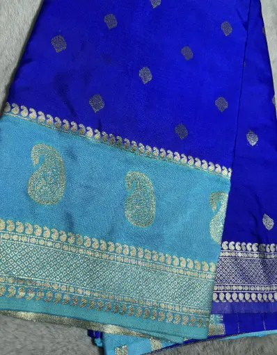 [E-COM040] Tussar silk saree in shades of royal blue and sky blue, beautifully woven with golden zari work.