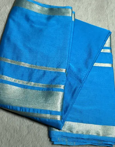 [E-COM041] graceful semi crepe silk saree in a refreshing sky blue shade with elegant Golden zari accents.